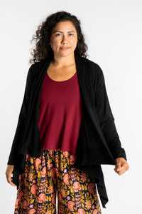 Teciane is wearing the Solid Color Cover-Up is Black