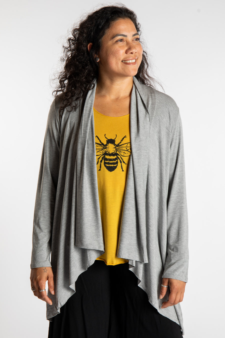 Teciane is wearing the Solid Color Cover-Up is Light Gray