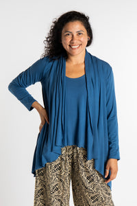 Teciane is wearing the Solid Color Cover-Up is Ocean
