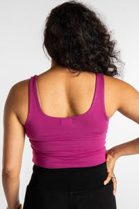 Teciane is wearing size M/L tank top in Pink