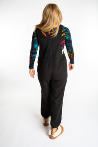 Sophie is wearing the S/M Black Fleece Overalls