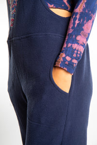 detail of navy fleece overalls pocket