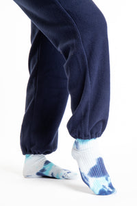 Detail of navy fleece overalls leg