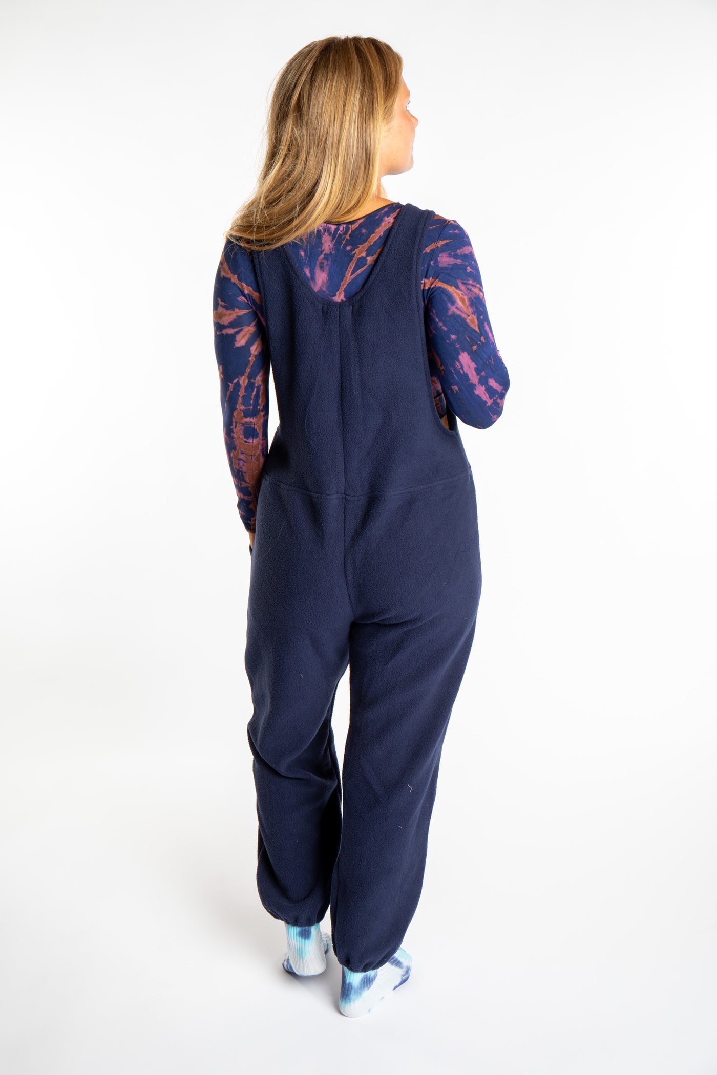 Sophie is wearing the S/M Navy blue Fleece Overalls