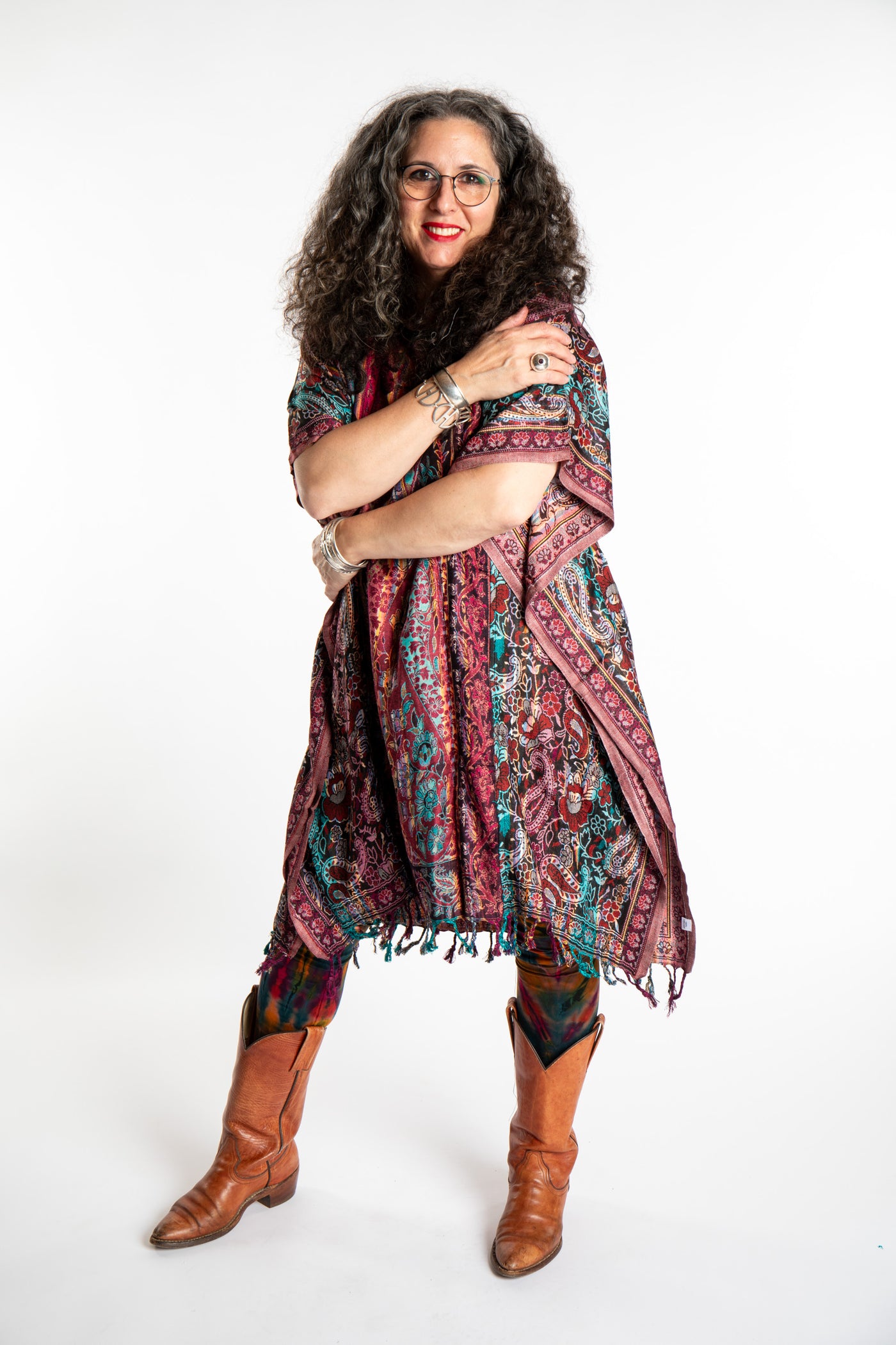 Susan is wearing the assorted one size Pari Poncho