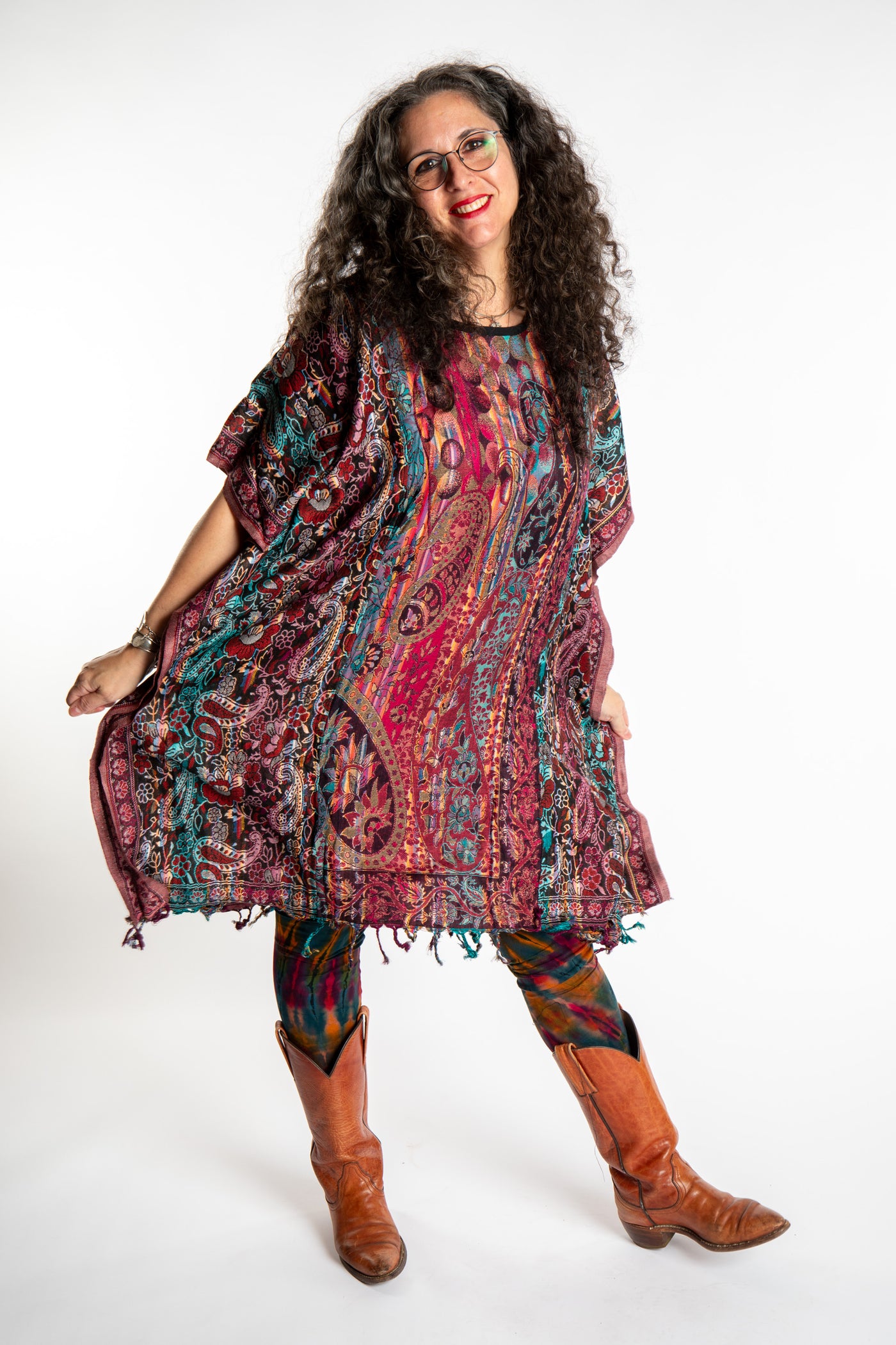 Susan is wearing the assorted one size Pari Poncho