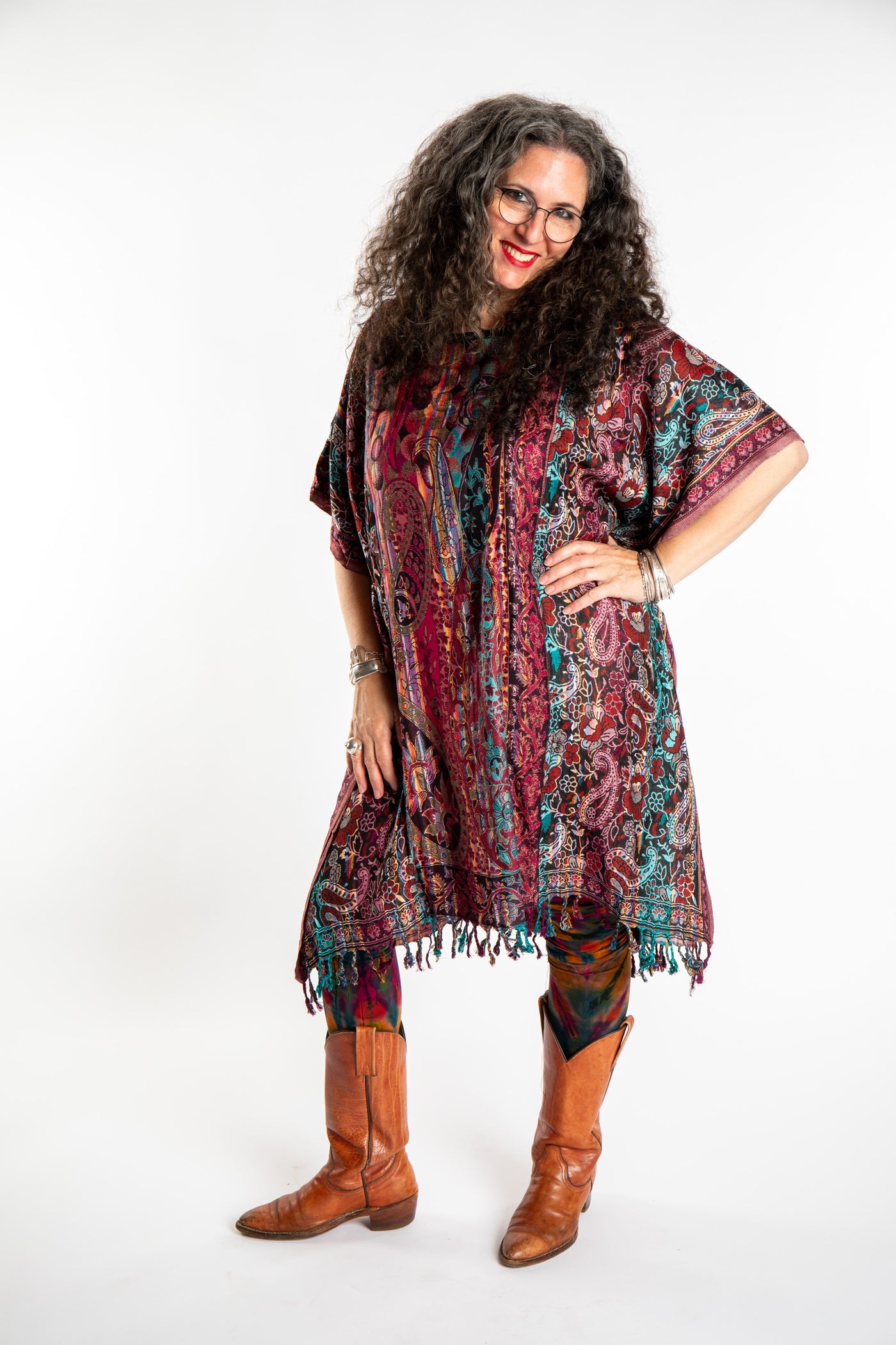 Susan is wearing the assorted one size Pari Poncho