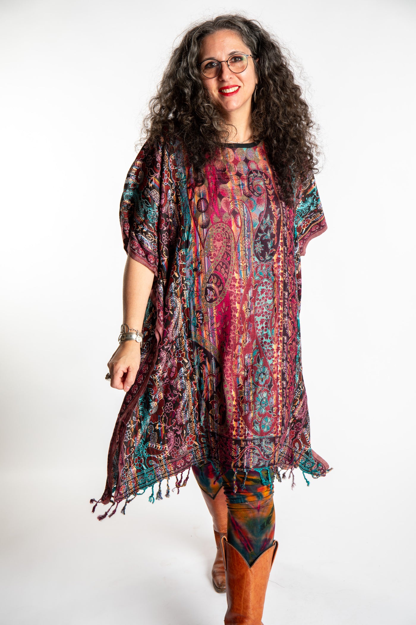 Susan is wearing the assorted one size Pari Poncho