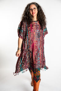 Susan is wearing the assorted one size Pari Poncho
