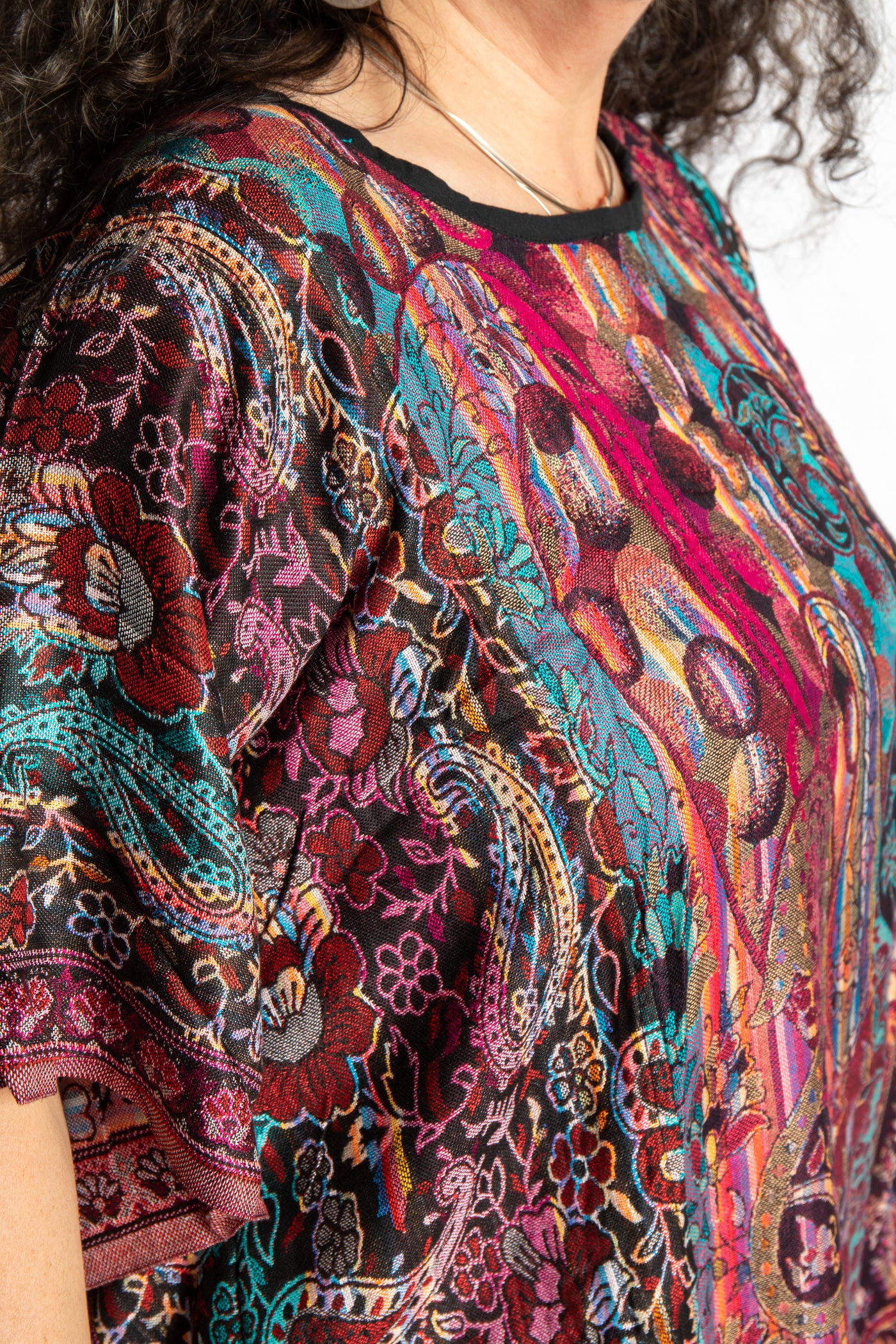 detail of the pari poncho neckline and chest