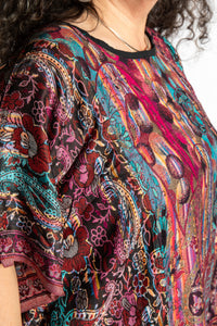 detail of the pari poncho neckline and chest