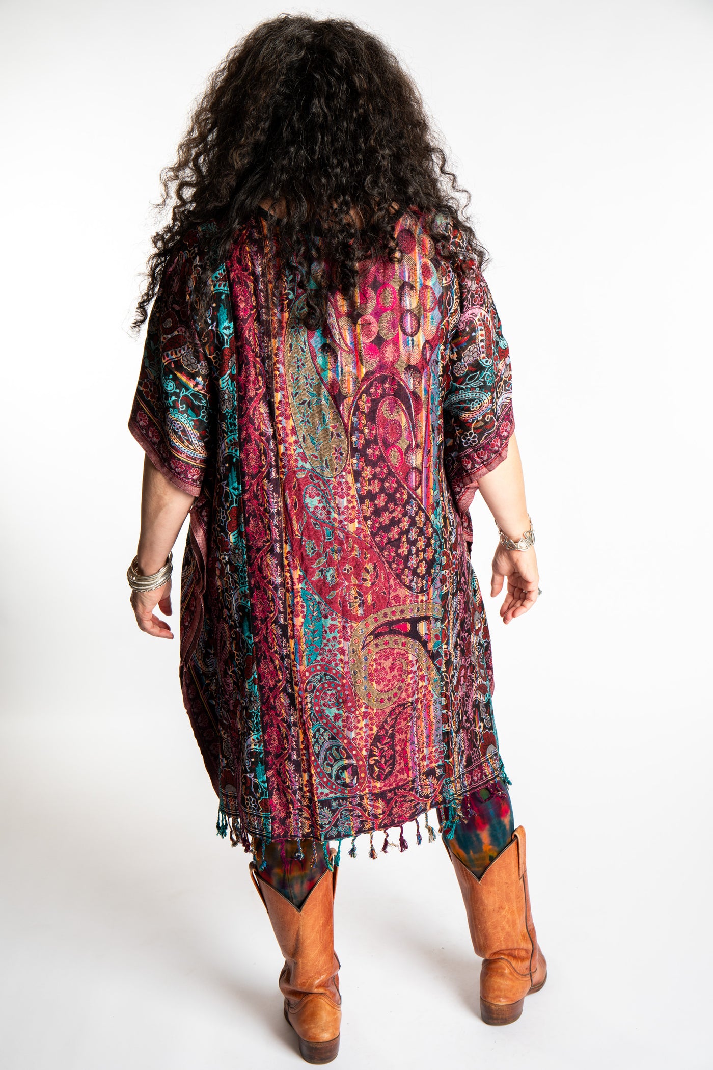 Susan is wearing the assorted one size Pari Poncho