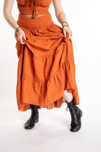 Honora is wearing Flowy Hippie Skirt in Terracotta