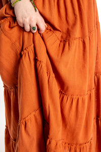 Honora is wearing Flowy Hippie Skirt in Terracotta