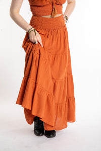 Honora is wearing Flowy Hippie Skirt in Terracotta