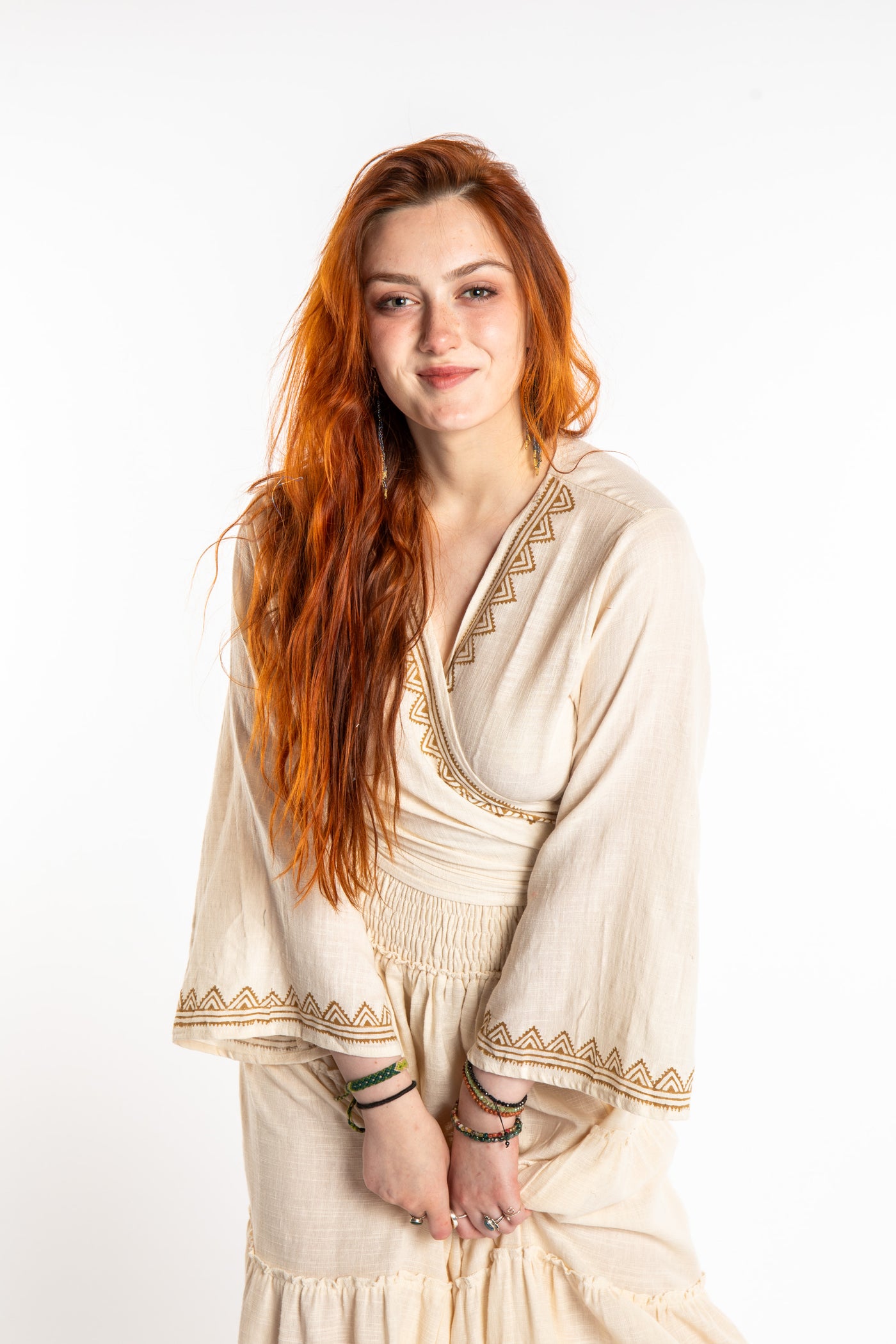 Honora is wearing Bohemian Wrap Top in Ivory