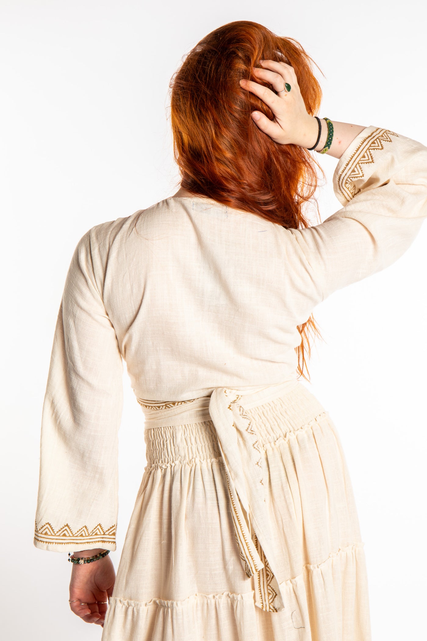 Honora is wearing Bohemian Wrap Top in Ivory