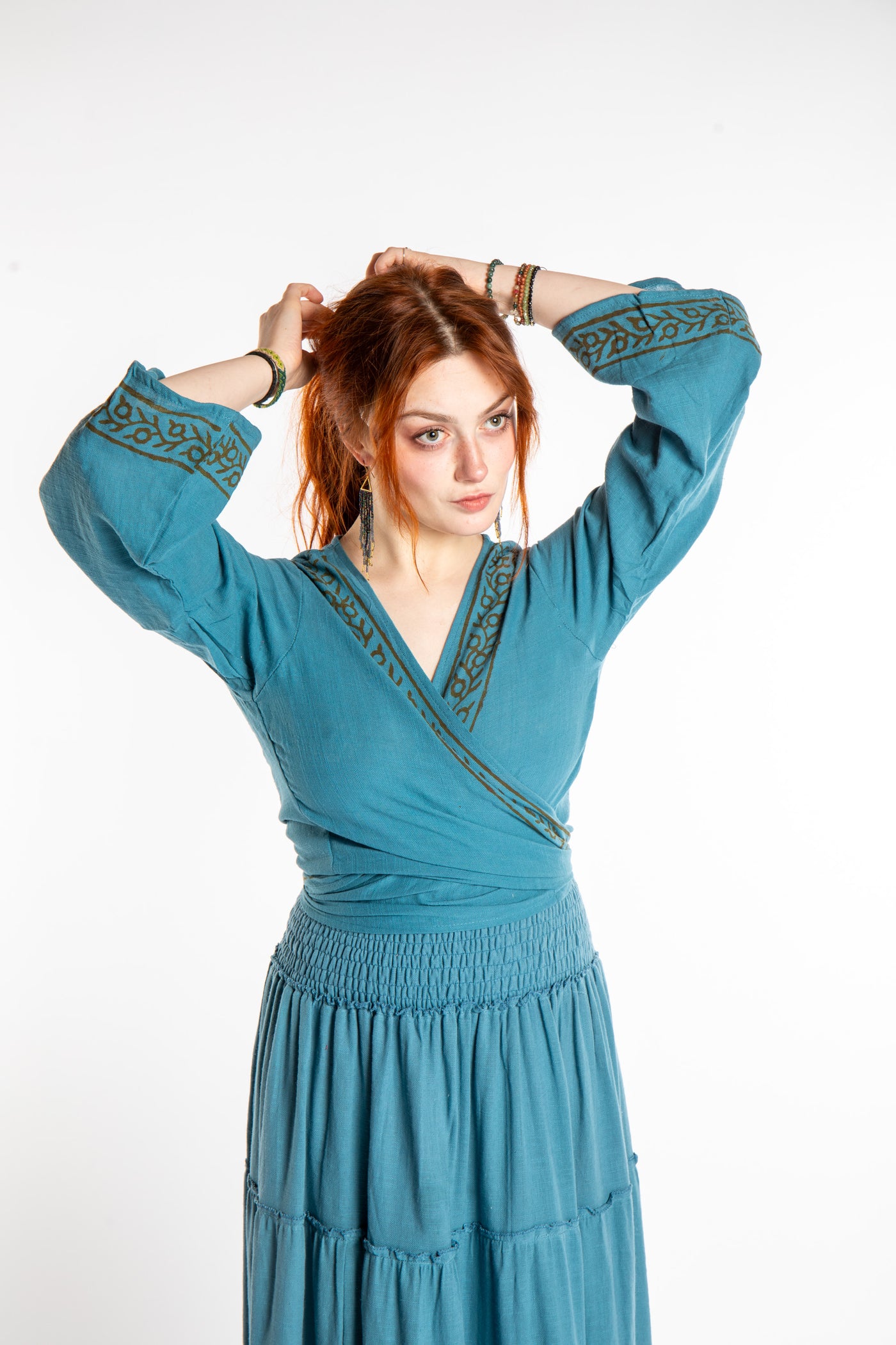 Honora is wearing Bohemian Wrap Top in Sea Blue
