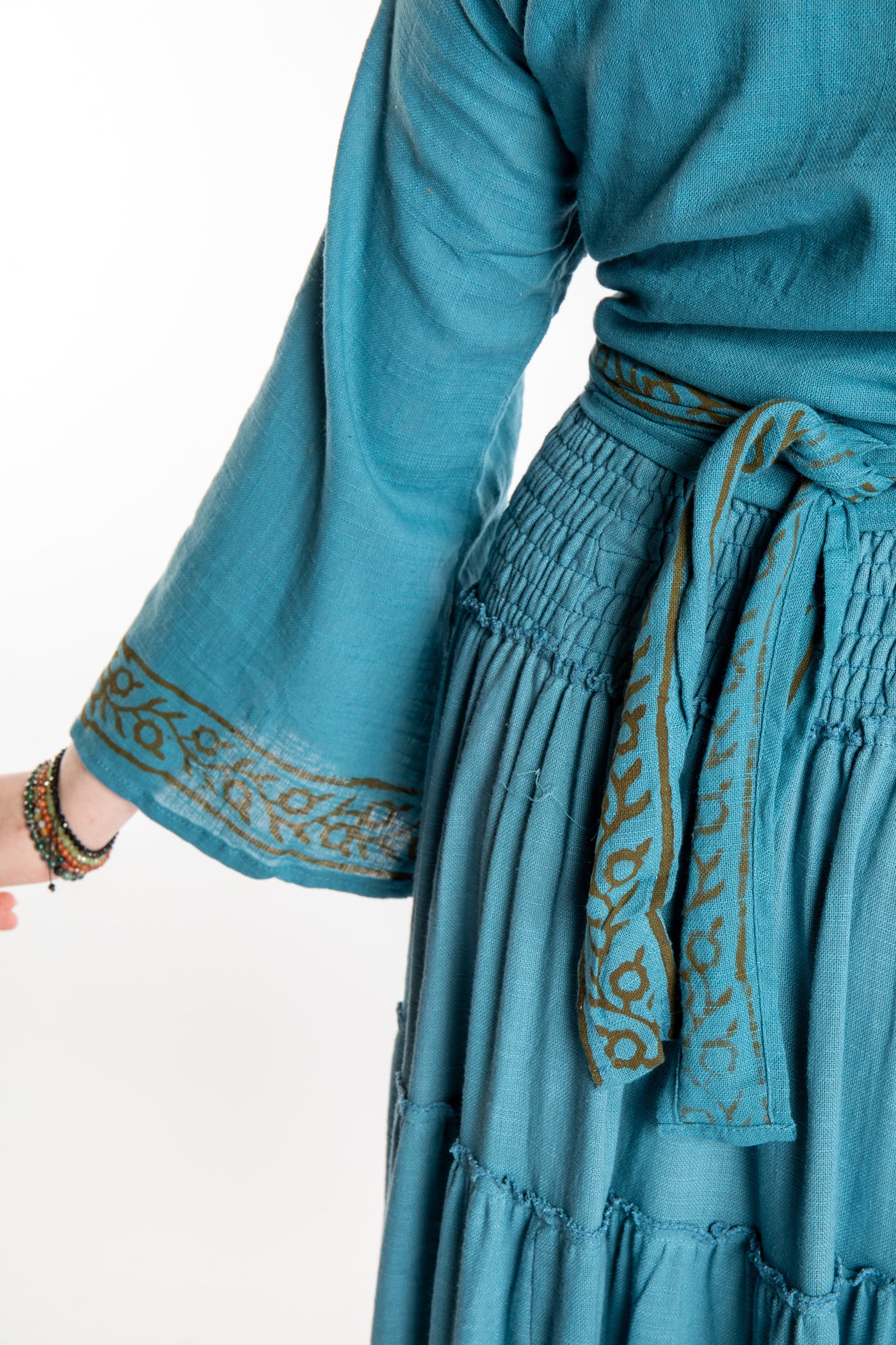 Honora is wearing Bohemian Wrap Top in Sea Blue