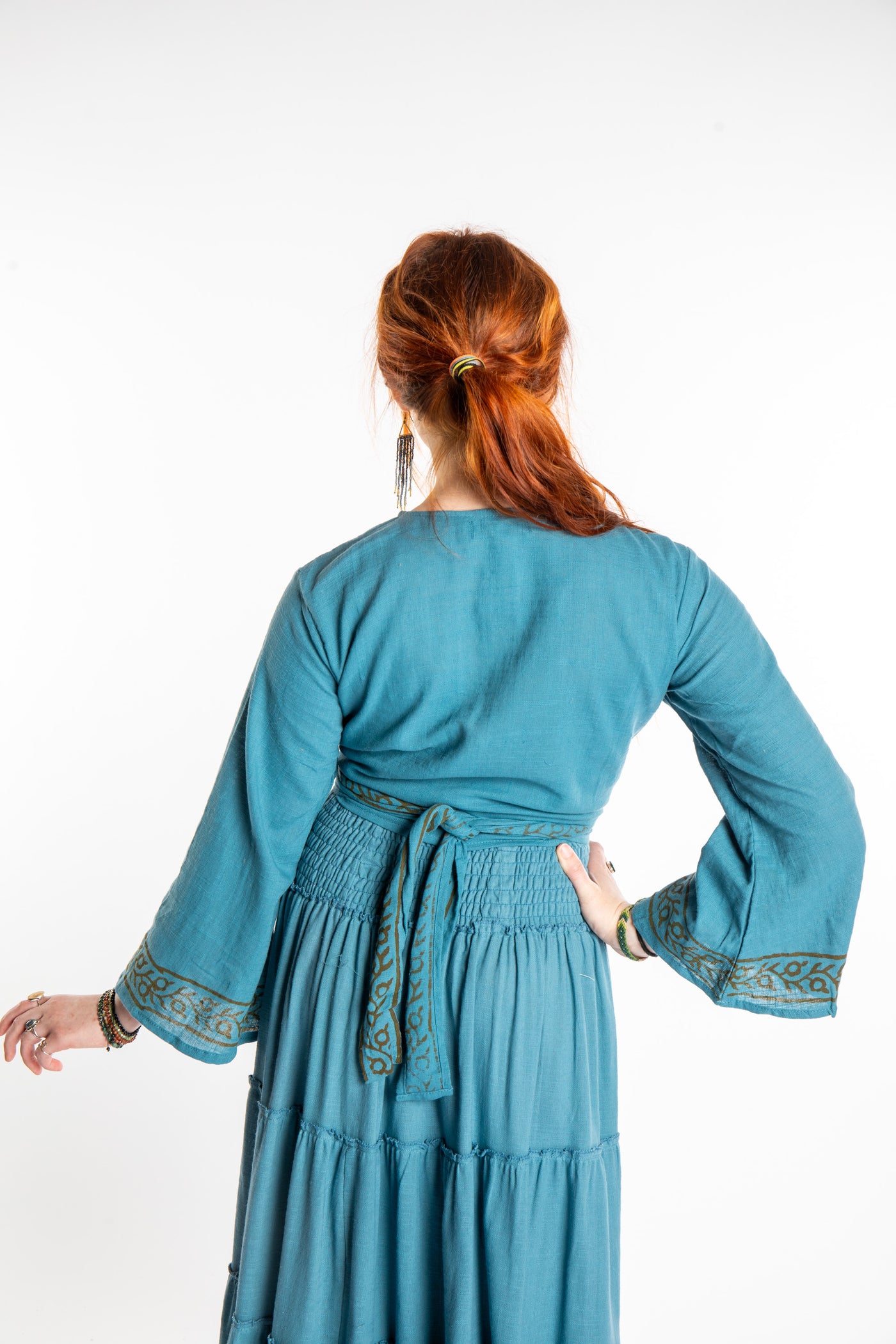 Honora is wearing Bohemian Wrap Top in Sea Blue