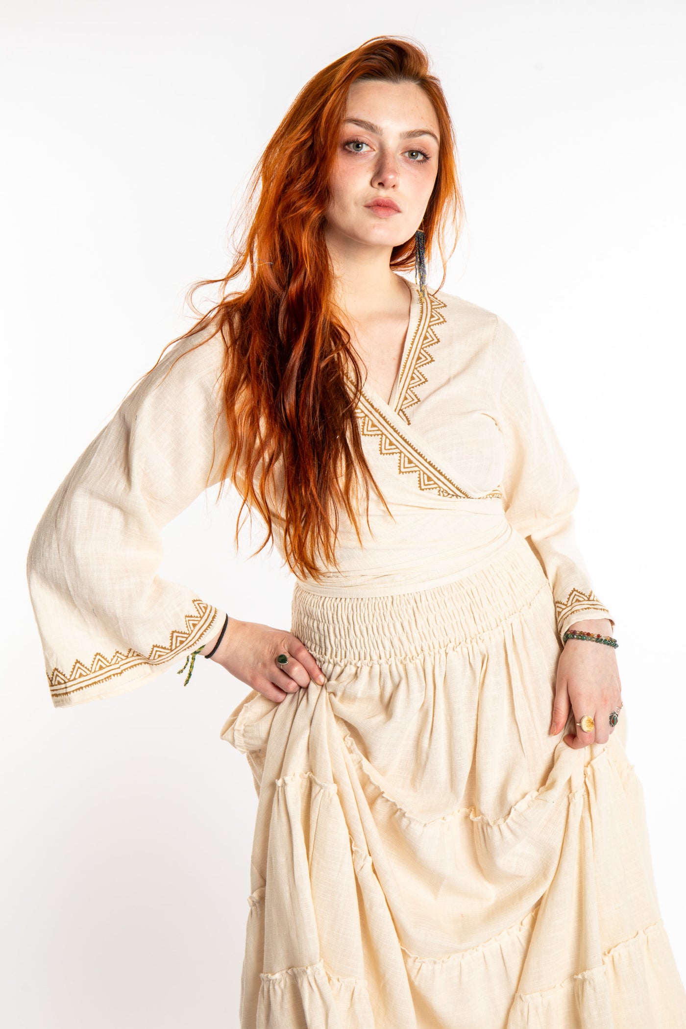 Honora is wearing Bohemian Wrap Top in Ivory