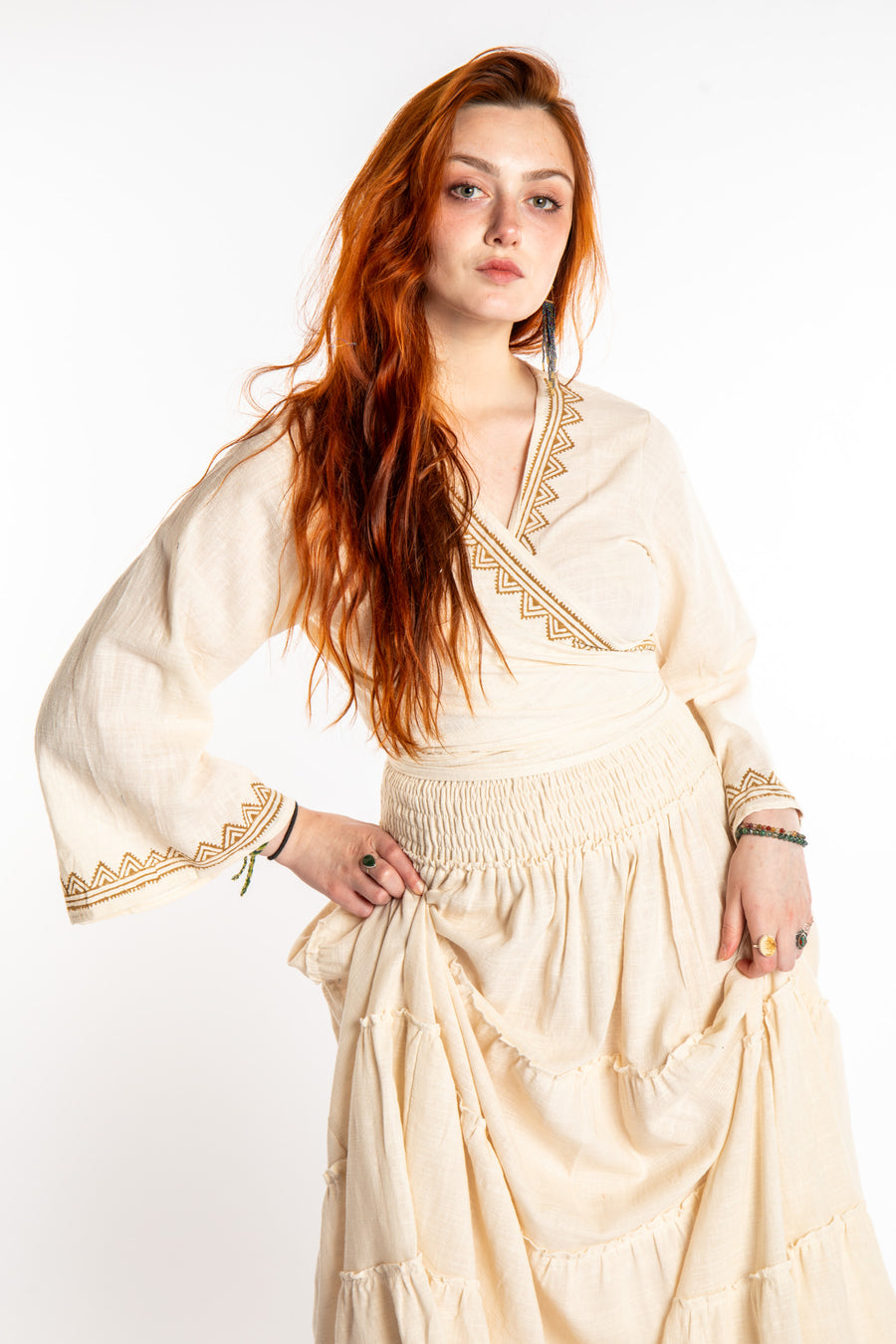 Honora is wearing Bohemian Wrap Top in Ivory