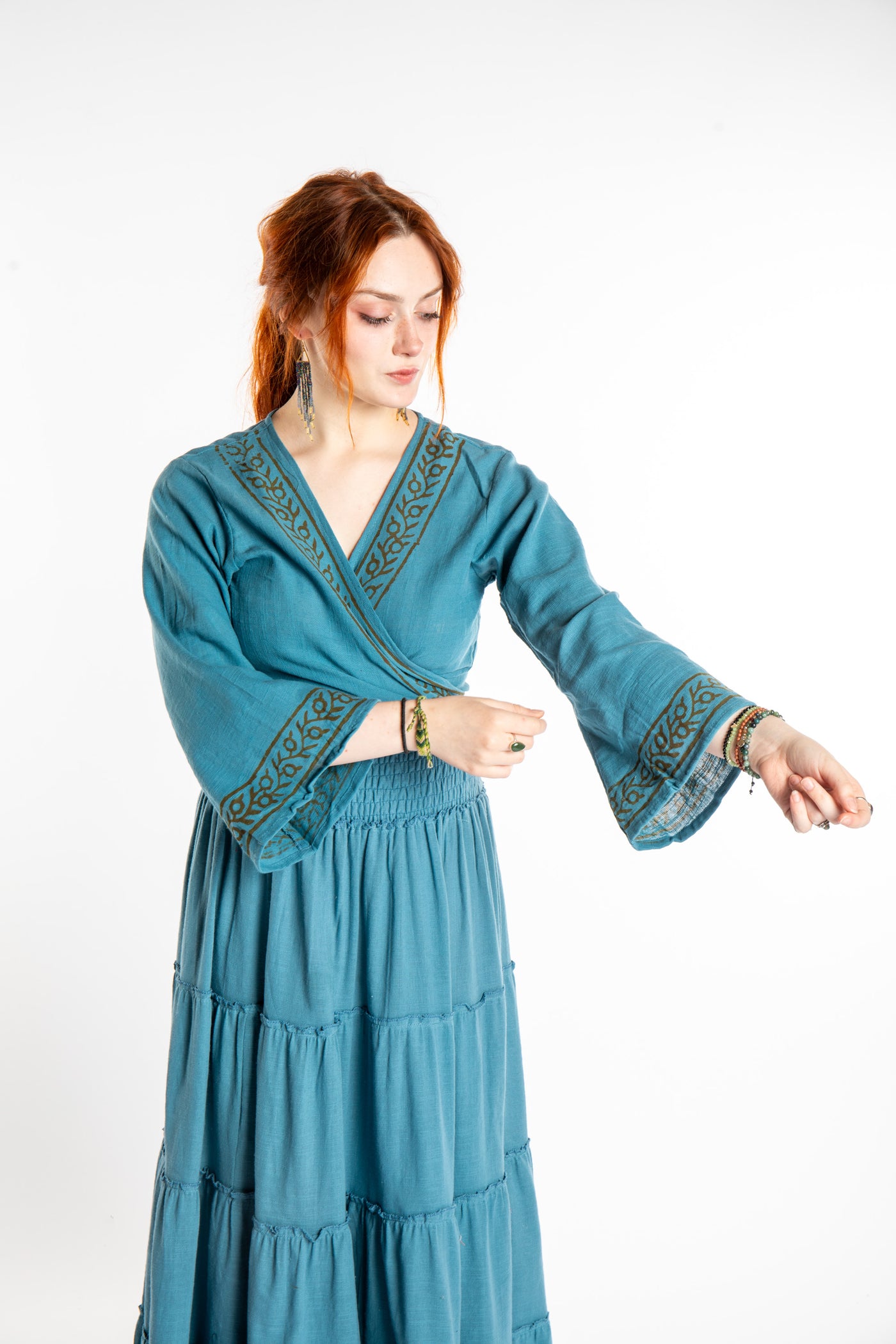 Honora is wearing Bohemian Wrap Top in Sea Blue