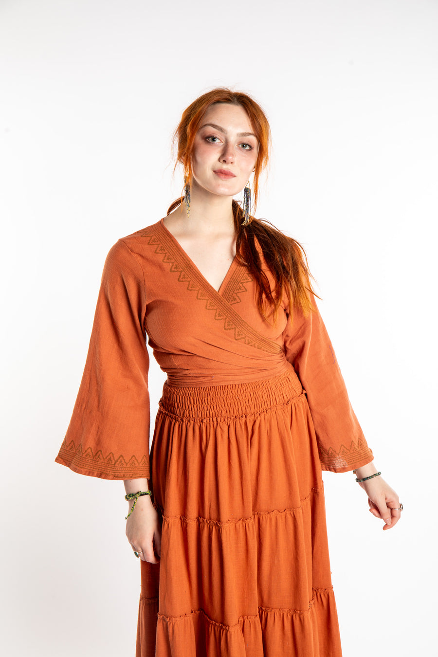 Honora is wearing Bohemian Wrap Top in Terracotta