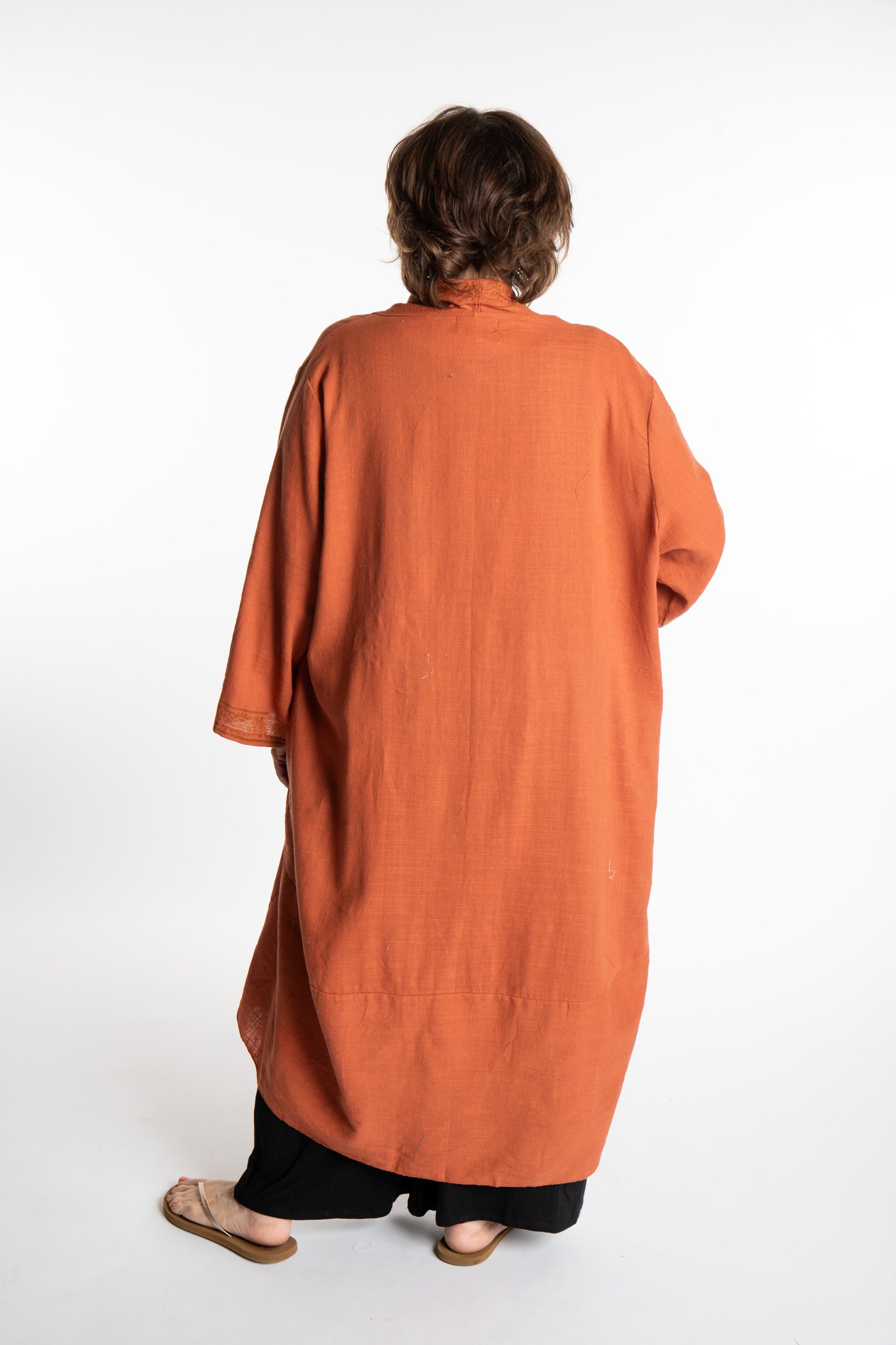 Betty is wearing a Boho Kimono Cover Up in Terracotta