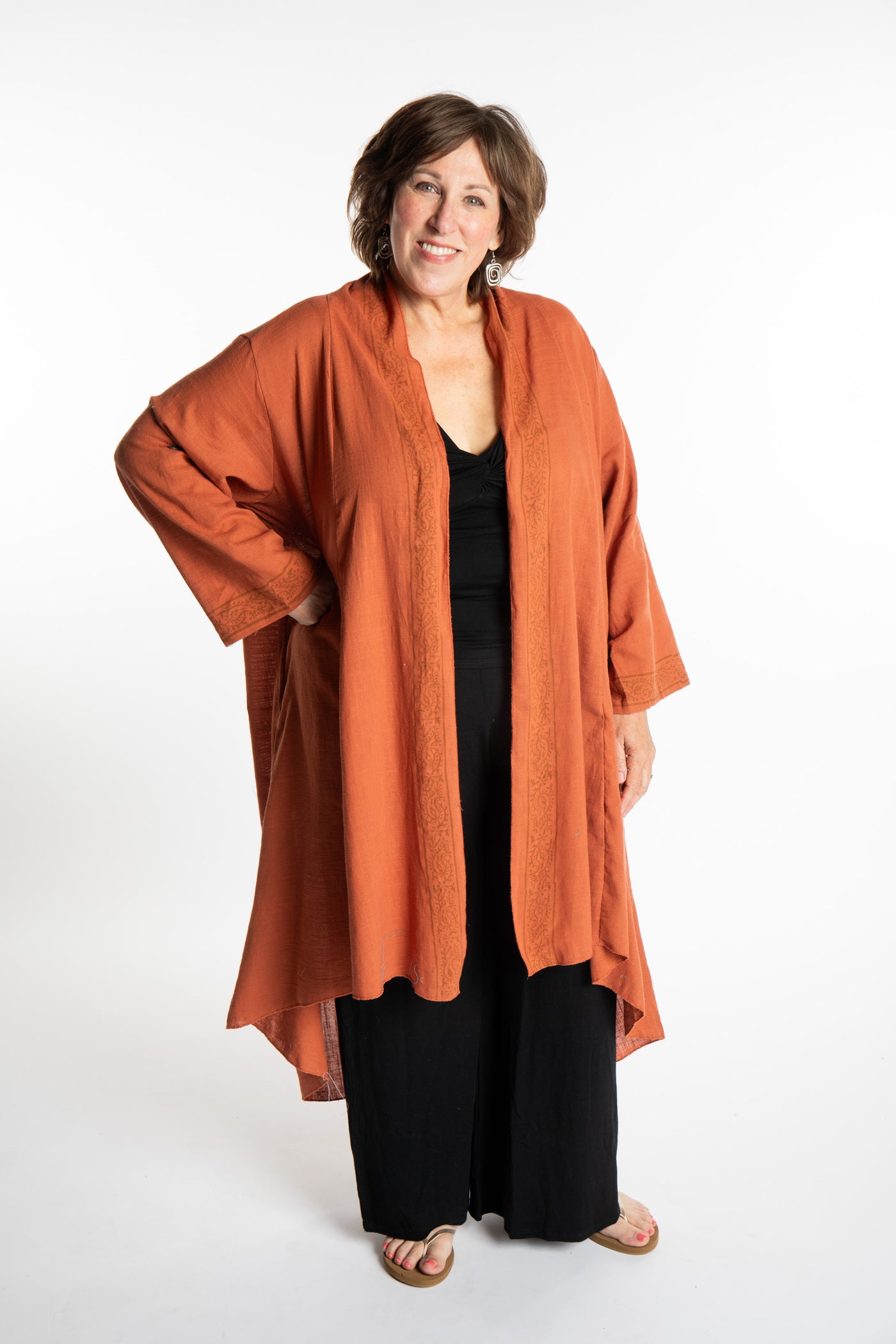 Betty is wearing a Boho Kimono Cover Up in Terracotta