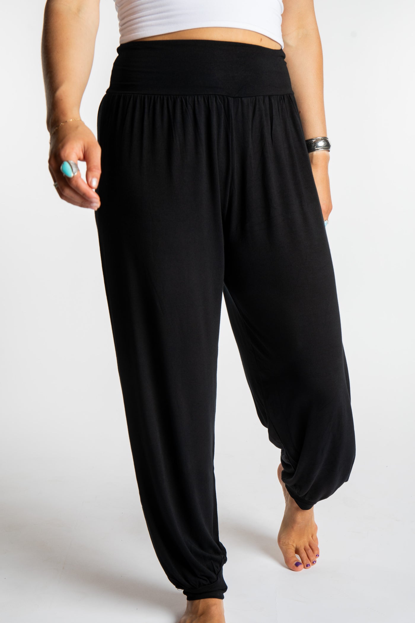 Sophie is wearing size S/M Solid Color Boho Pants in Black