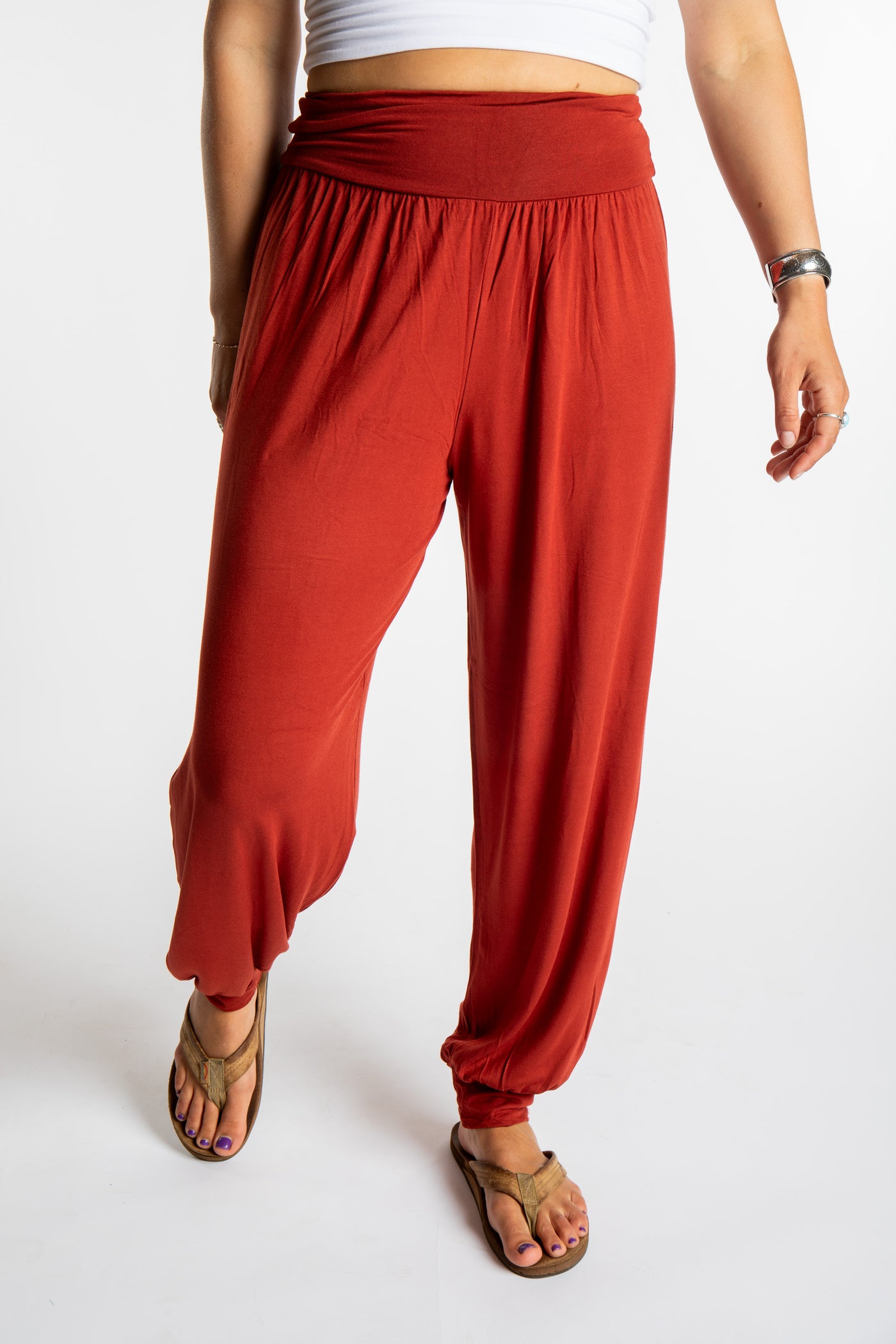 Sophie is wearing size S/M Solid Color Boho Pants in Terracotta