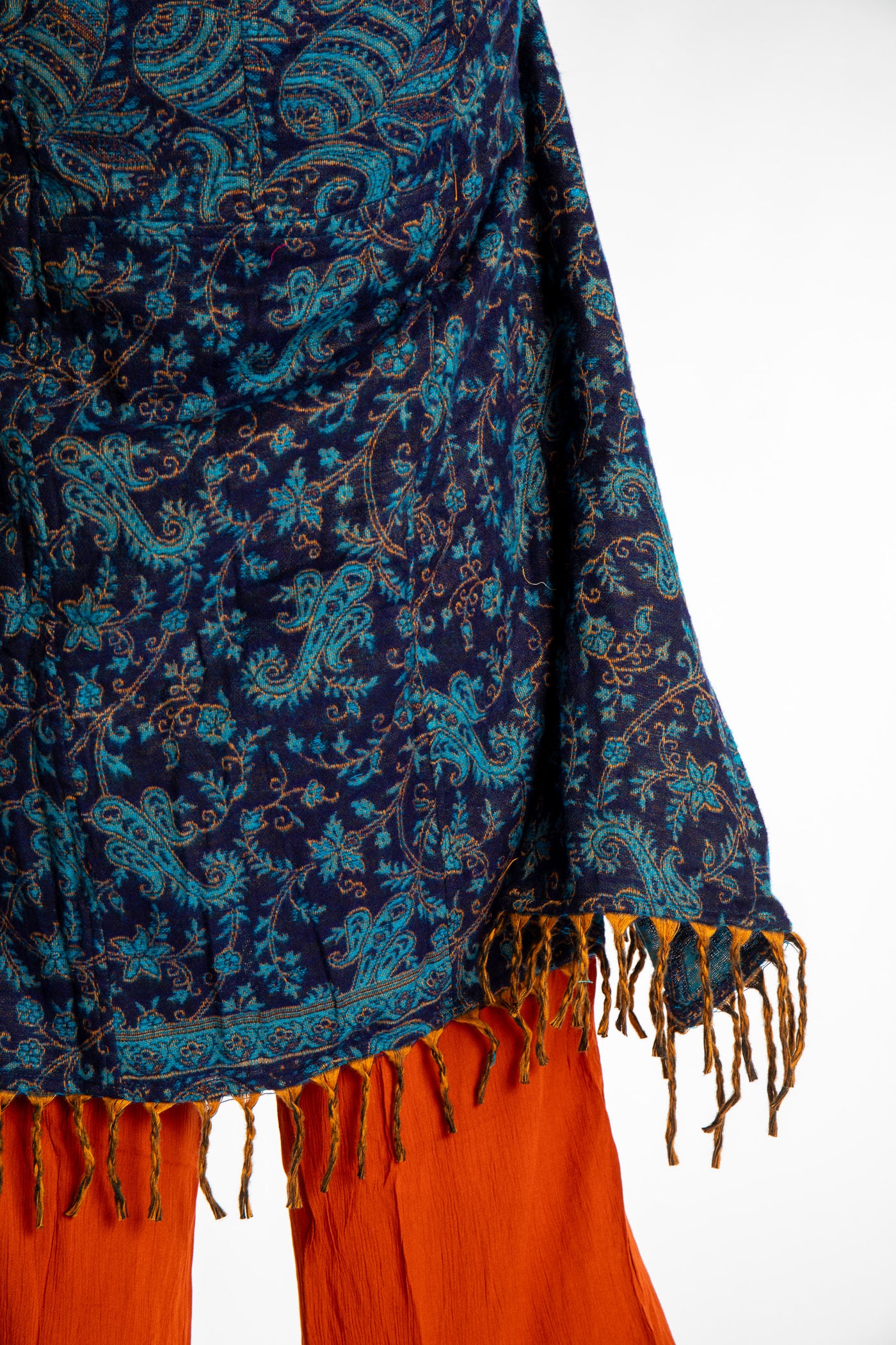 detail of the fringe on the blue paisley patterned blanket jacket