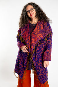 Susan wearing the Purple and orange multicolored paisley patterned blanket jacket 
