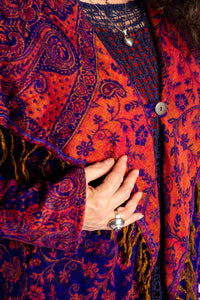 Susan wearing the Purple and orange multicolored paisley patterned blanket jacket 