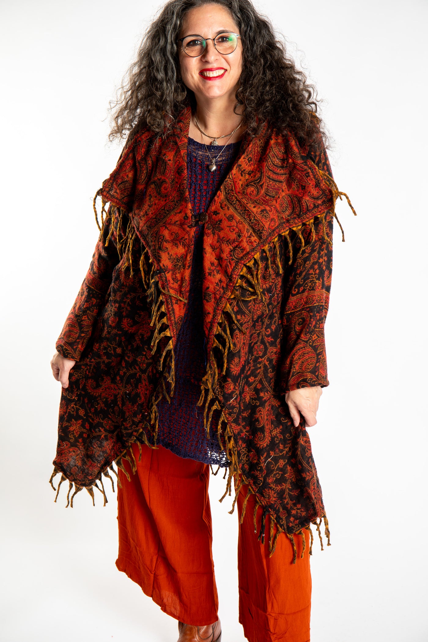 Susan wearing the Red, orange and black multicolored paisley patterned blanket jacket 