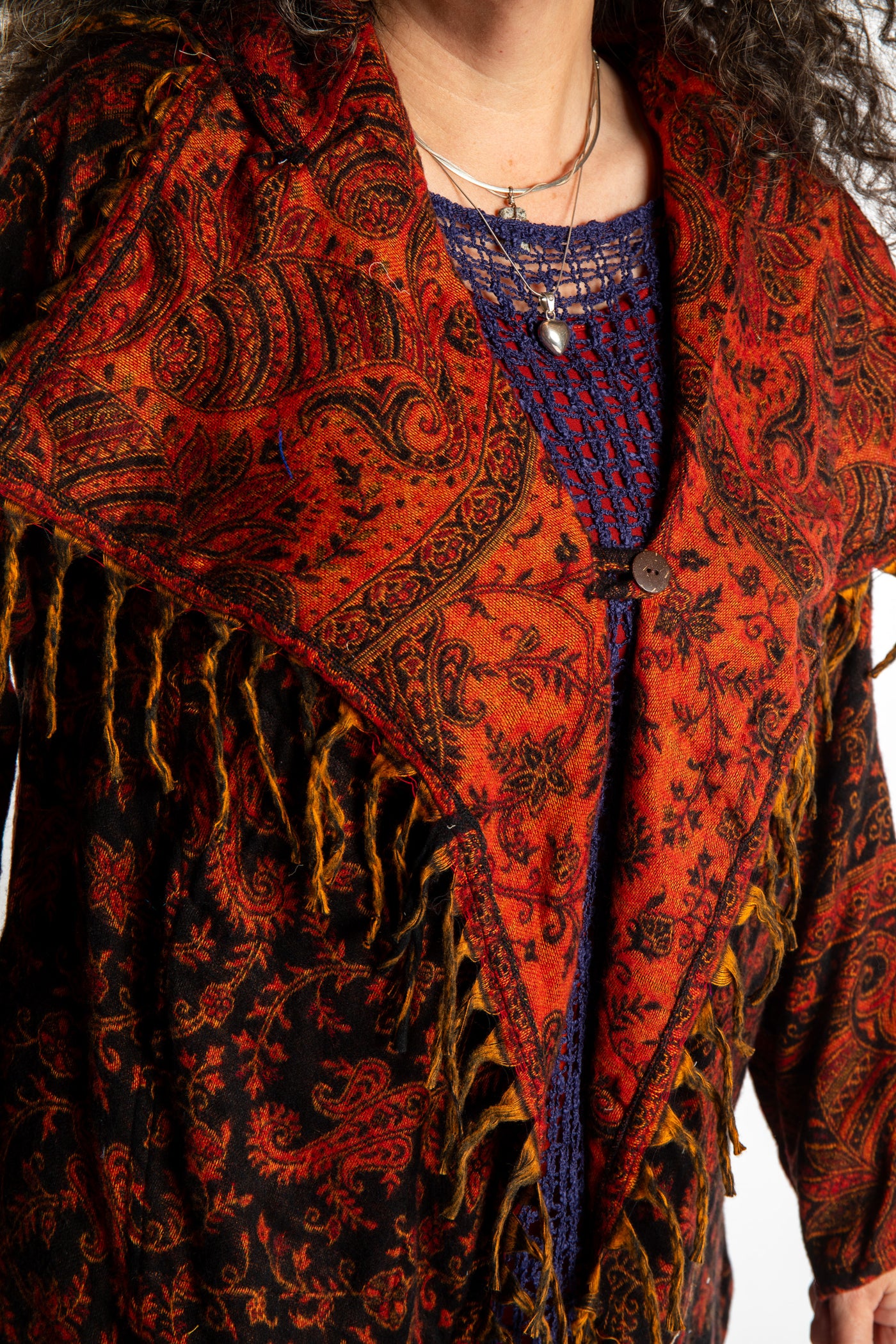 Susan wearing the Red, orange and black multicolored paisley patterned blanket jacket 