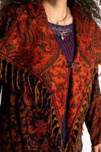Susan wearing the Orange and black multicolored paisley patterned blanket jacket 