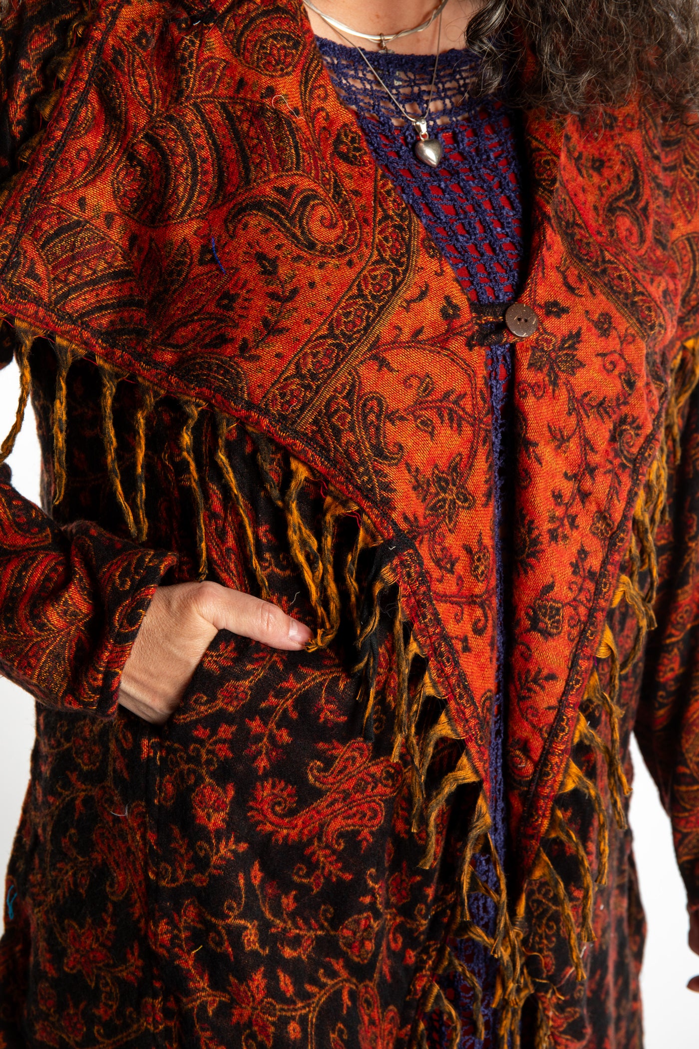 Susan wearing the Red, orange and black multicolored paisley patterned blanket jacket 