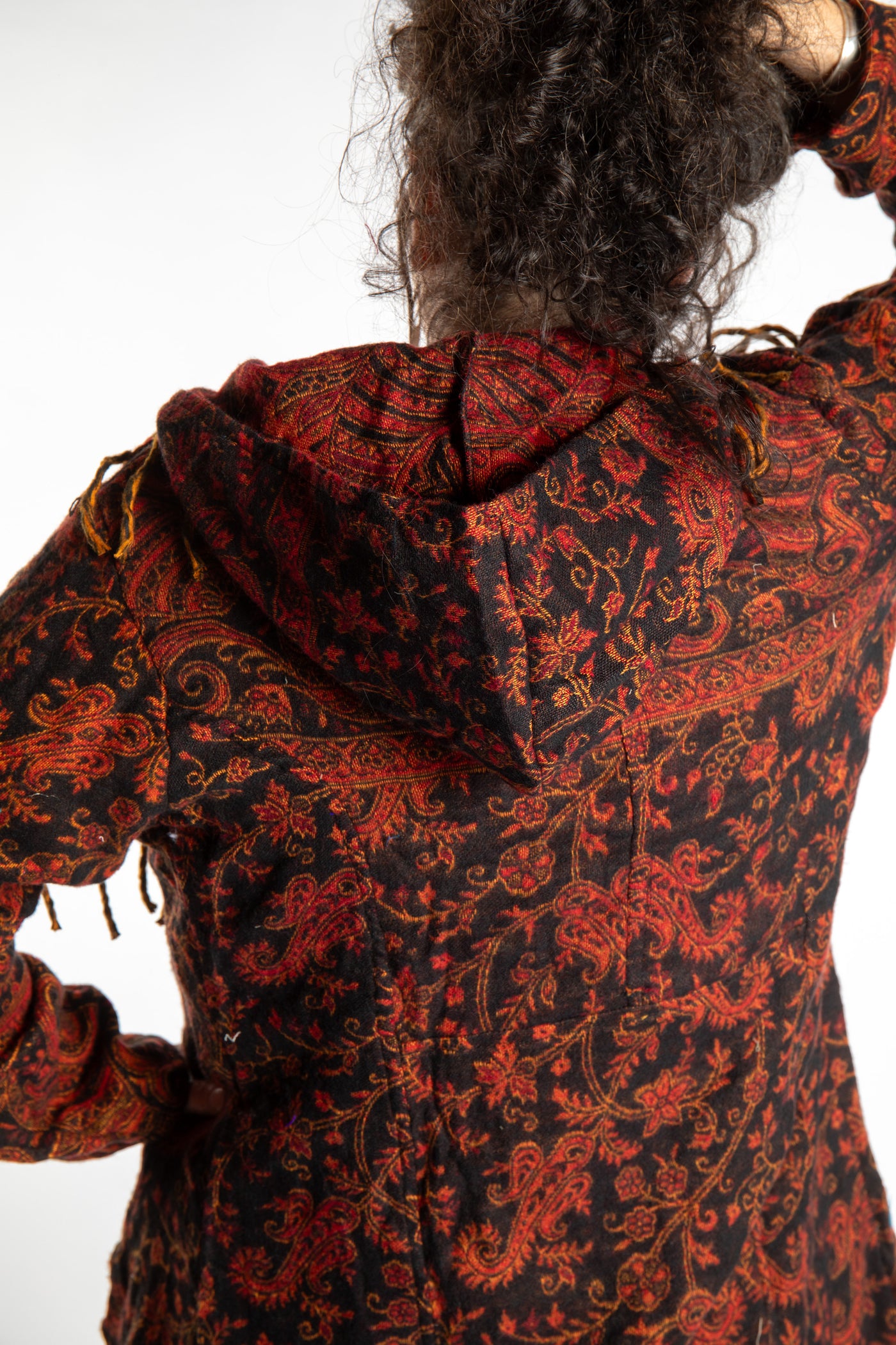 Susan wearing the Red, orange and black multicolored paisley patterned blanket jacket 