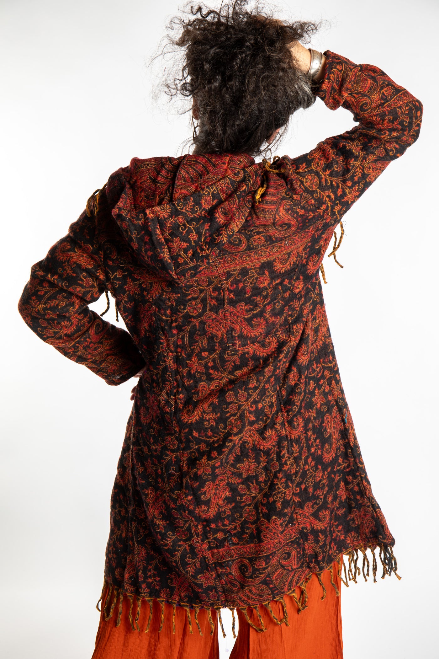 Susan wearing the Red, orange and black multicolored paisley patterned blanket jacket 