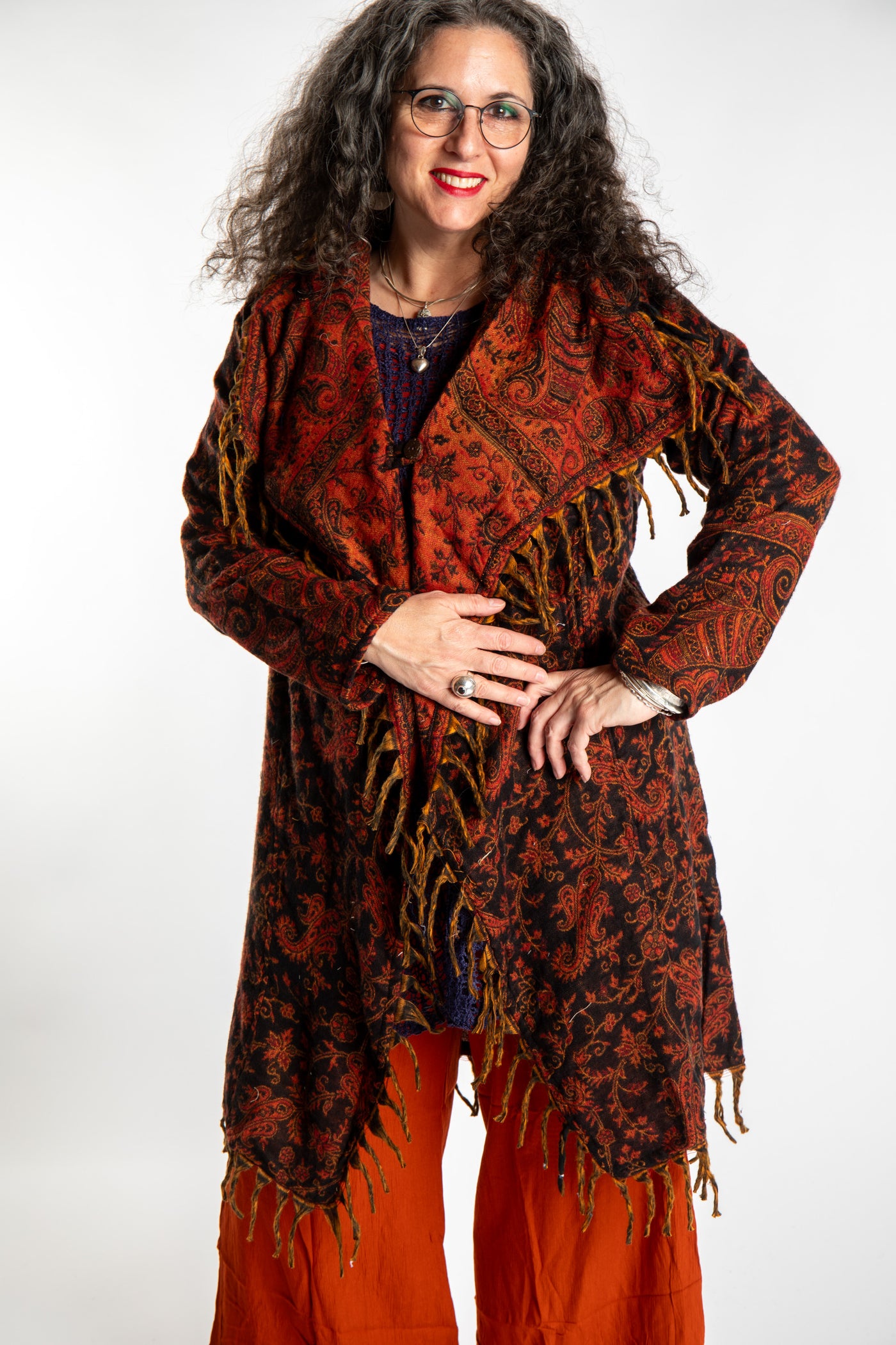 Susan wearing the Red, orange and black multicolored paisley patterned blanket jacket 