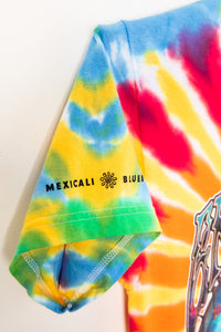 Colorful tie-dye shirt with 'Mexicali Blues' logo on a white background