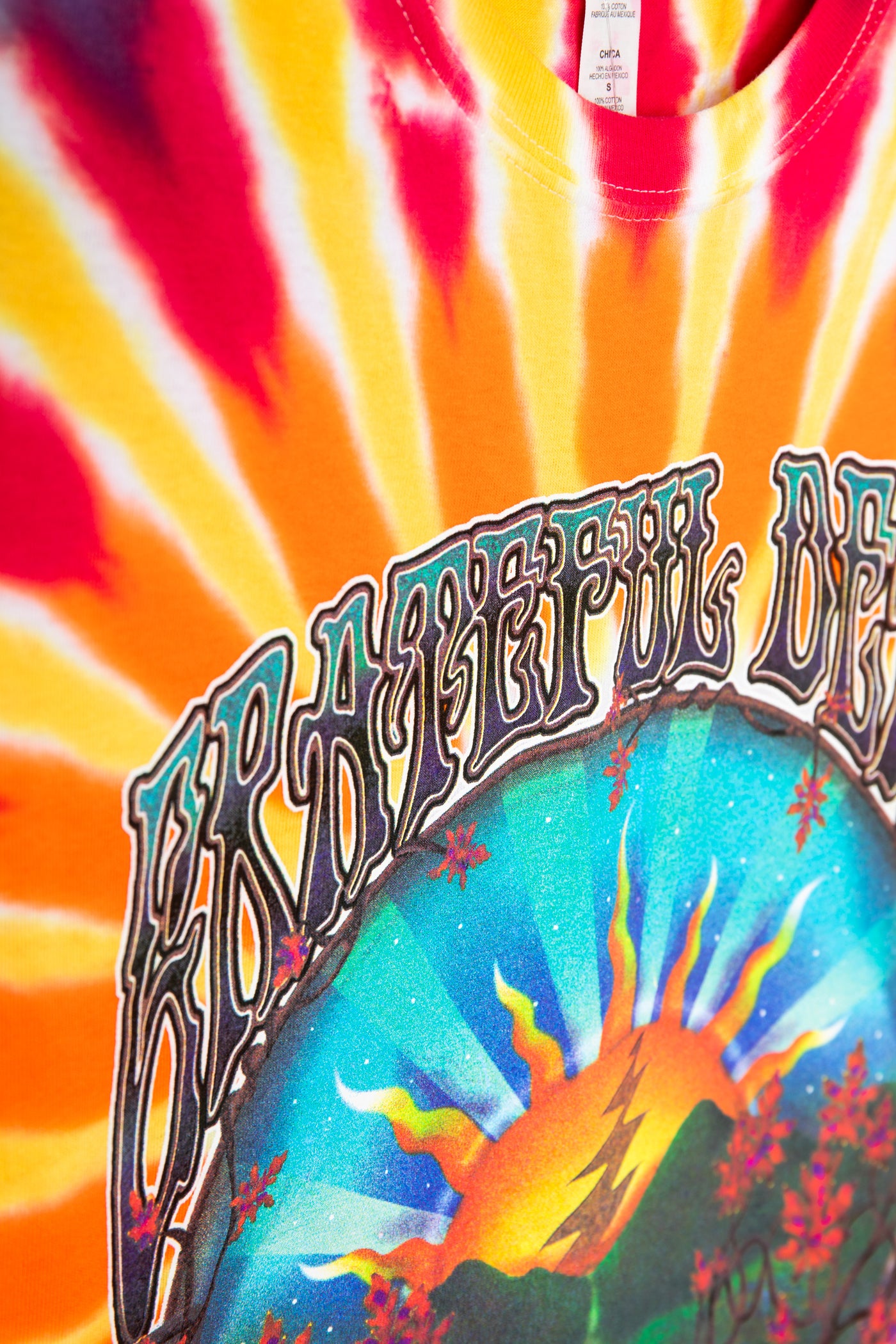 Tie-dye shirt with colorful design and text on a multicolored background