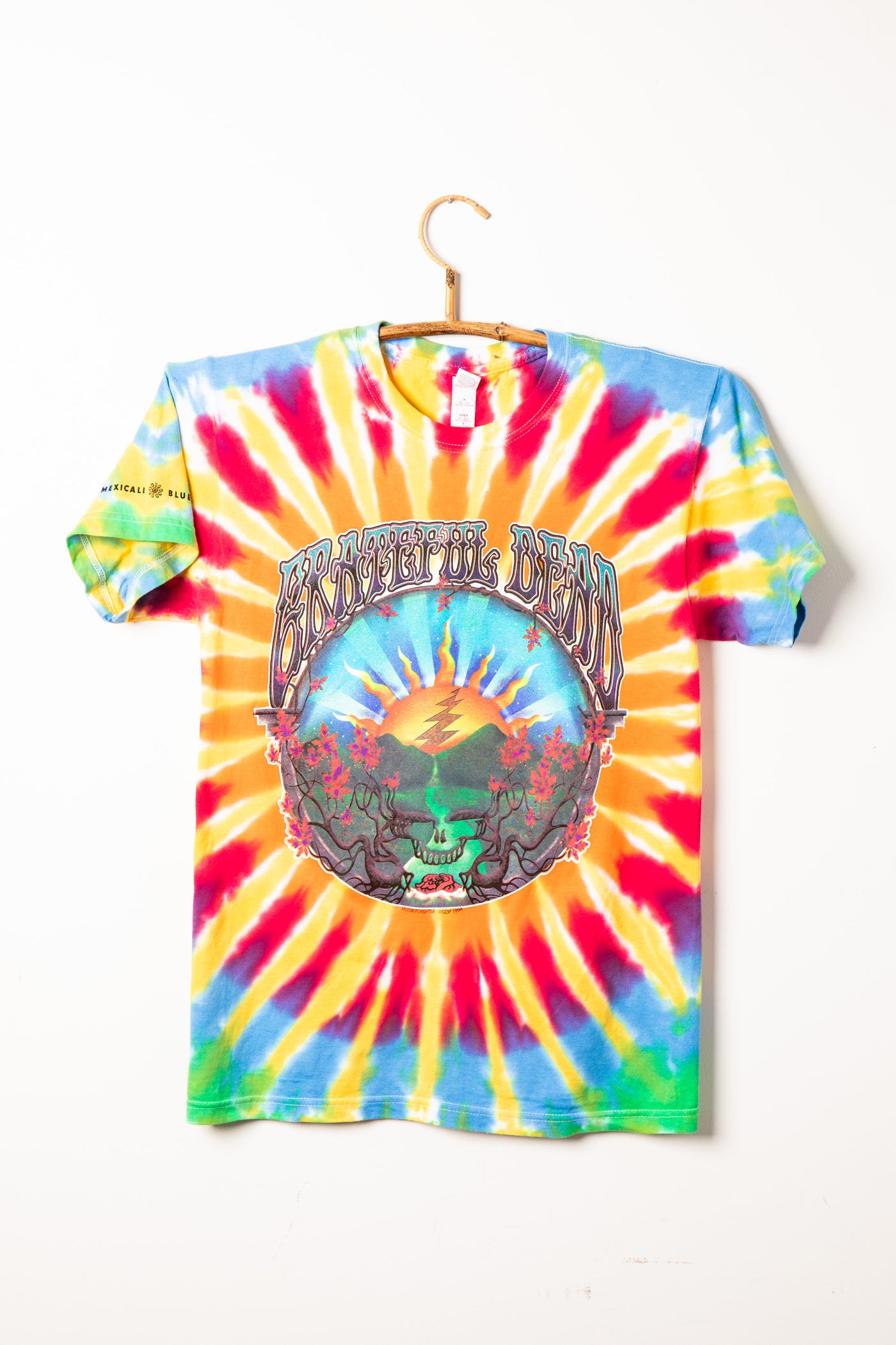 Grateful Dead tie-dye t-shirt with a Steal Your Face graphic design on a white background