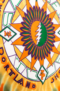 Colorful tie-dye pattern with a prominent green leaf design and 'Portland' text.