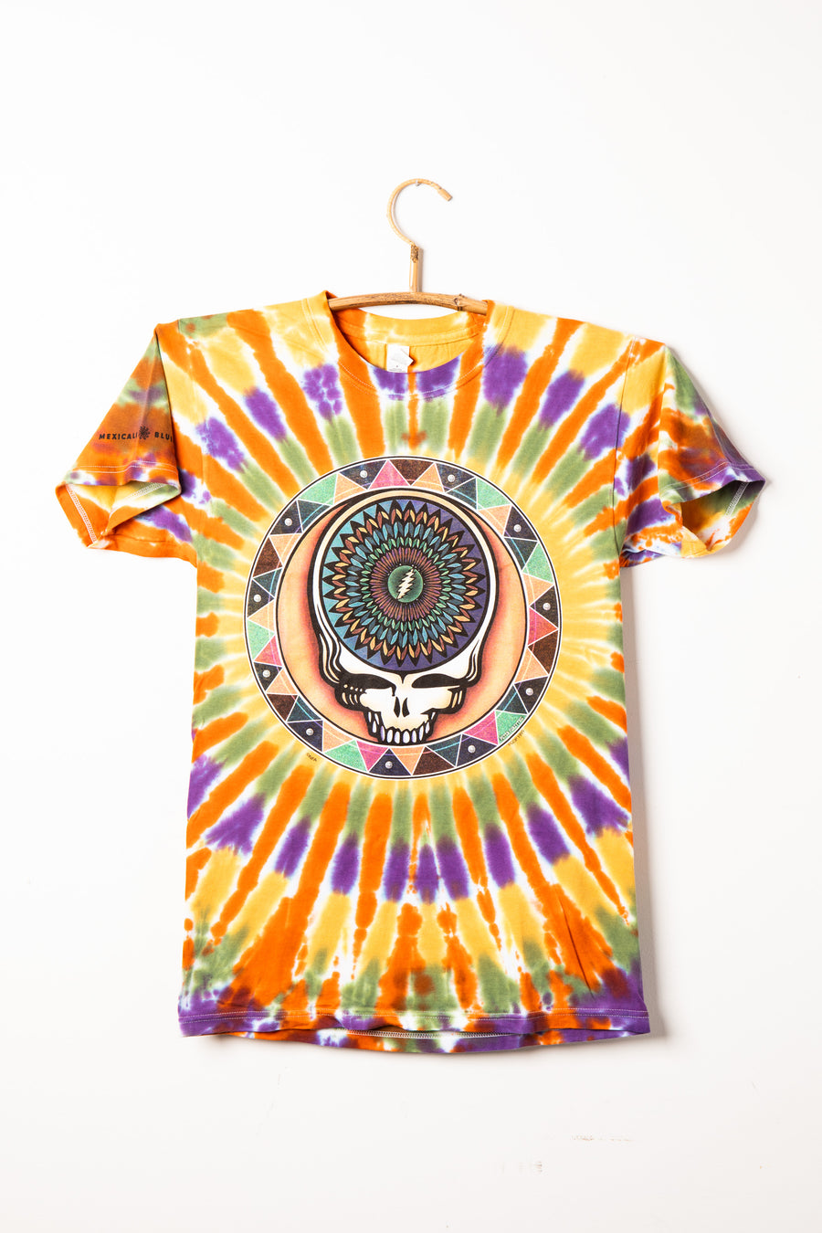 Colorful Grateful Dead tie-dye t-shirt with a Steal Your Face and mandala design on a white background
