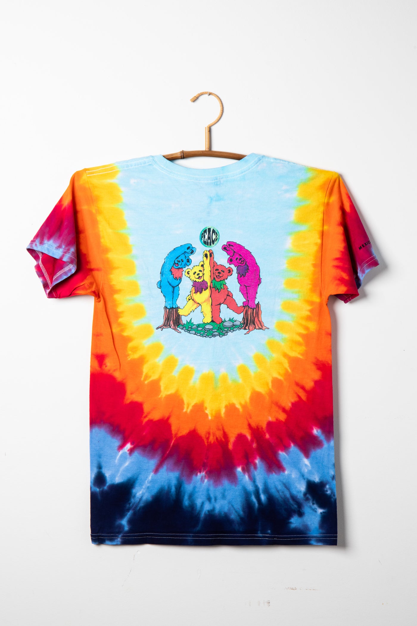 Grateful Dead Bear tie-dye t-shirt with colorful animal design on a white background