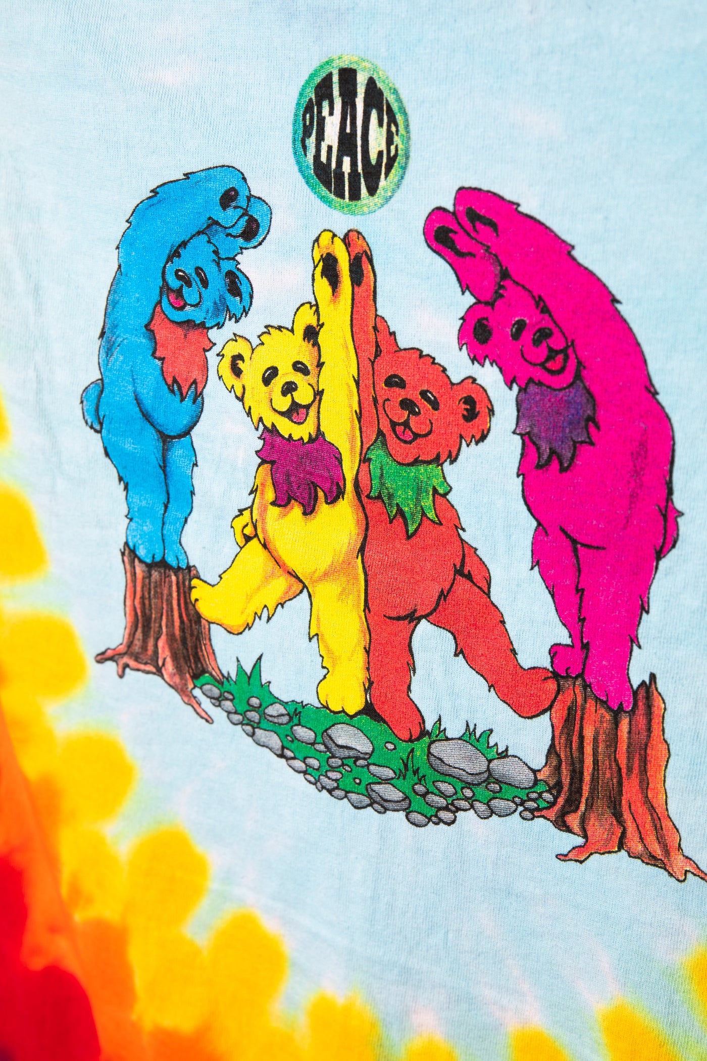 Colorful Grateful Dead dancing bear graphic with a 'PEACE' graphic on a tie-dye background