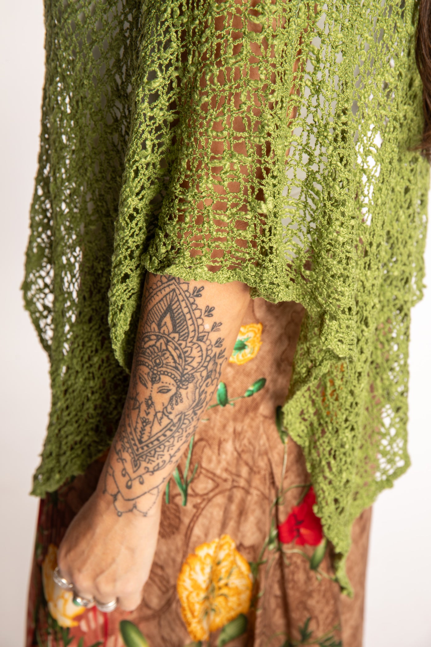 Jen is wearing the Avocado loose weave shawl